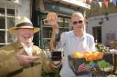John Potter, chairman of the Bradford on Avon Flower and Produce show, with the new Marmalade  Cup alongside fruit store owner  Graham Forrester who supplies cooks with the renowned  Seville oranges for the competition