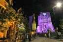 Malmesbury Abbey goes purple for charity. Picture by Robert Peel .