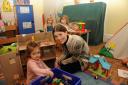 MP Michelle Donelan visits Castle Gardens nursery to show support for the playschool facing closure if they cannot find an alternative venue. Michelle  at the Dolls house with Francesca.  Pics Trevor Porter