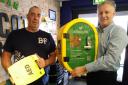 (L-r) Trucker Steve Arundel, who drives for David Jenkins of Bridgend, with Chippenham Pit Stop general manager, Neal Walford, and the defibrillator,