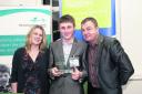 Jack Fradgley, centre, being handed an outstanding achievement award from sponsors Pearson Assessment