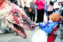 Dinosaurs take to the streets ahead of show