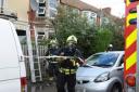 Firefighters at the house in Innox Road