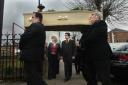 Hannah Fisher's mother and stepfather, centre, arrive for the funeral in Wootton Bassett