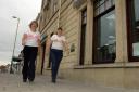 Mandy Martin and Val Phillips stride out, wearing the distinctive Walk The Walk t-shirts ahead of their fundraising trip to Iceland.