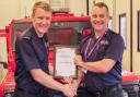 Assistant chief fire officer Glenn Bowyer awarded Sam Edwards a Chief Fire Officer’s Commendation.