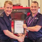 Assistant chief fire officer Glenn Bowyer awarded Sam Edwards a Chief Fire Officer’s Commendation.