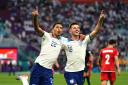 England's Jude Bellingham celebrates scoring their side's first goal of the game with team-mate Mason Mount during the FIFA World Cup Group B match at the Khalifa International Stadium, Doha. Picture date: Monday November 21, 2022. PA Photo