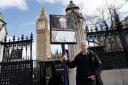 A man holding a placard outside the Houses of Parliament in central London, before former prime minister Boris Johnson gives evidence at a hearing of the Commons Privileges Committee as to whether he knowingly misled Parliament over partygate.  Picture