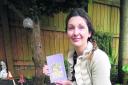 Sarah Hill with her fourth book in the Whimsy Wood series