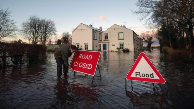 This Is Wiltshire: Homes at risk of flooding are urged to follow advice from the Environment Agency. (PA)