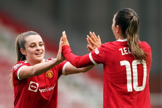 Manchester United’s Ella Toone (left) and Katie Zelem celebrate their side’s first goal of the game