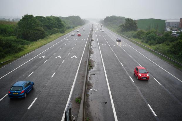 This Is Wiltshire: Cars driving on a motorway. Credit: PA