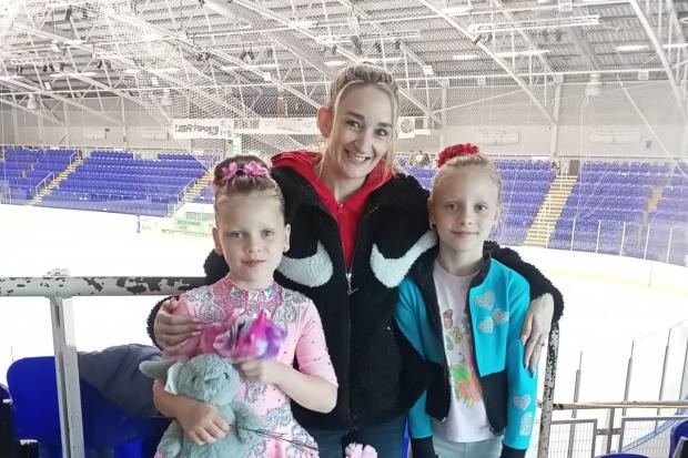 The Riasna sisters pictured with their coach -  (left to right) Anna Riasna (6) Swindon-born British Pairs Skating Champion Zoe Jones and Tetiana Riasna (7)