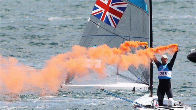 Ben Ainslie of Great Britain celebrates overall victory after competing in the men's Finn Sailing medal race on Day 9 of the London 2012 Olympic Games at Weymouth & Portland 